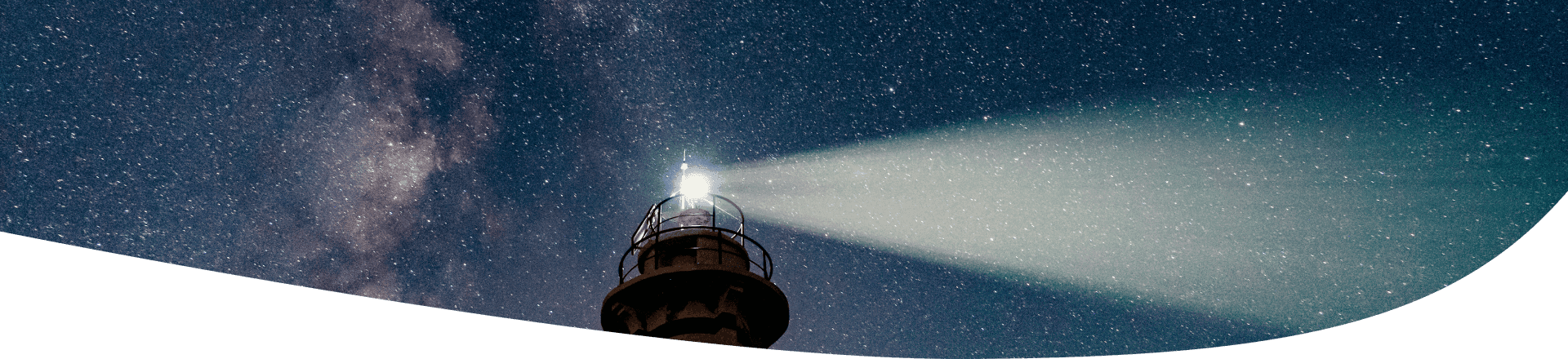lighthouse under the milk way