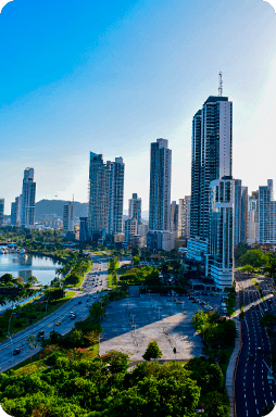 Panama City, Panama, modern skyline of tall waterfront skyscrapers and multilane roads under a clear blue sky
